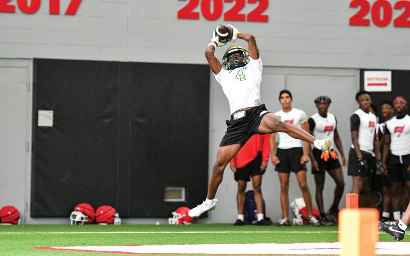 Wade Cheek/The Clayton Tribune. Rabun Gap senior wideout C.J. Willingham snags a touchdown catch at the Georgia 7-on-7 team camp at the University of Georgia. The Eagles participated in seven straight days of camps.