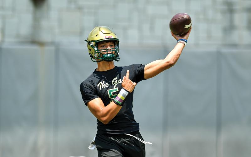 Wade Cheek/The Clayton Tribune. Three-year starting Rabun Gap quarterback Gavin Owens fires a pass during the Georgia 7-on-7 team camp at the University of Georgia on Tuesday, June 10.