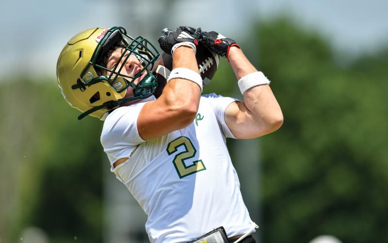 Wade Cheek/The Clayton Tribune. Wideout Walker Bryson tries to snag an over-the-shoulder catch in a 7-on-7 matchup at the University of Georgia on Tuesday, June 10.