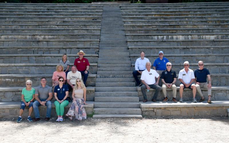 Enoch Autry/The Clayton Tribune. Group members of those invited for a camp tour sit in Stewart Amphitheatre at Camp Rainey Mountain.