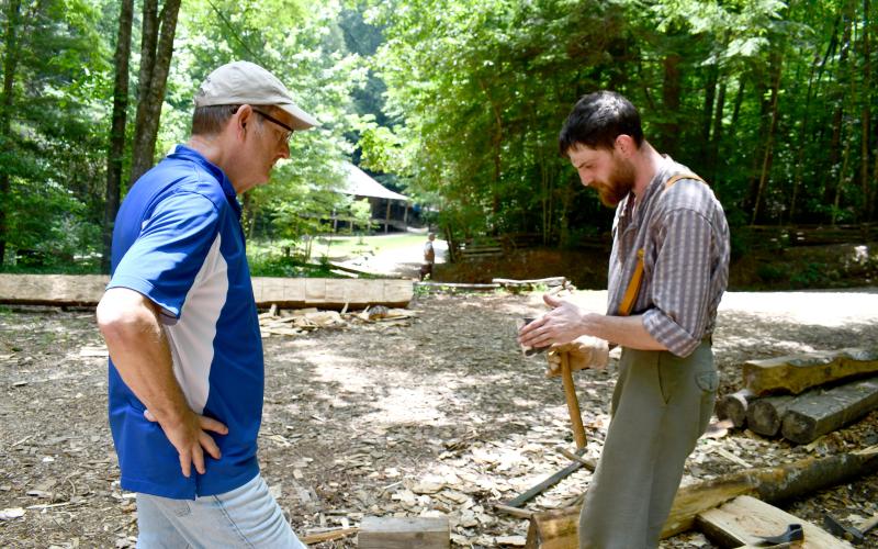Megan Horn/The Clayton Tribune. Steven Webster (left) visits the Foxfire Museum during Heritage Days on Friday, June 6, and asks demonstrator Christopher Botkin about his craft. The two-day event was a fundraiser for the Mountain City nonprofit.