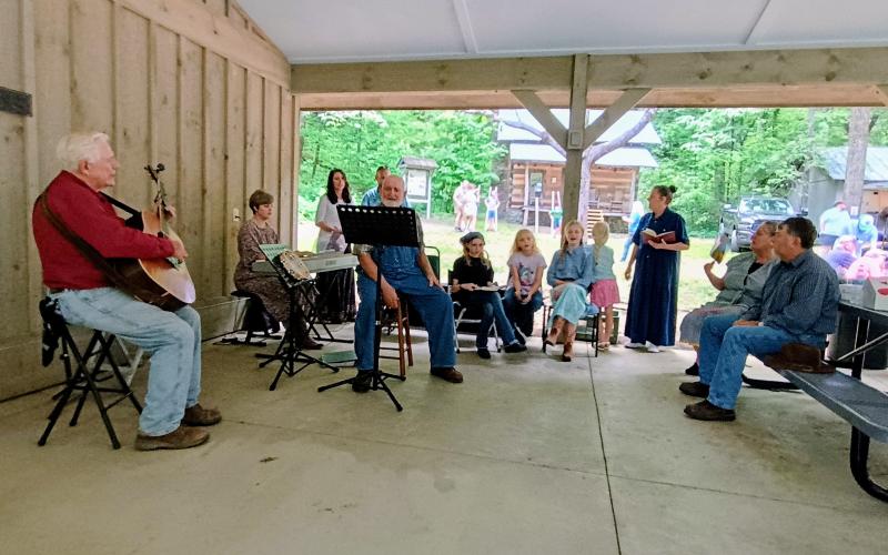 Megan Horn/The Clayton Tribune. Event-goers to Foxfire Heritage Days enjoy Gospel singing and old-time music performed live at the Reeves Pavilion on Friday, June 6.