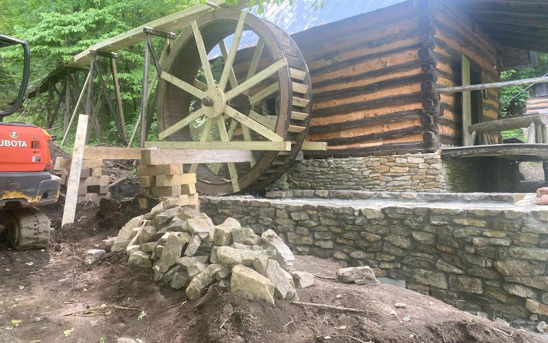 Photo courtesy of Foxfire. A view of the Gristmill and water wheel at Foxfire while it was under construction. Thanks to the help of Reeves and an anonymous volunteer, it is refurbished and working again.