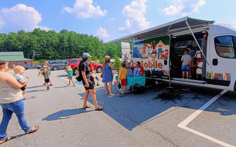 Megan Horn/The Clayton Tribune. The Northeast Georgia Regional Library System’s Bookmobile was on site at the Rabun County Public Library for the Summer Reading program launch on Tuesday, June 3, themed “Color Our World.” The Bookmobile is a scaled-down version of the library with its own collection. Its purpose is to bring services to people in Rabun County and the Northeast Georgia Regional Library System who may not be able to visit the library.