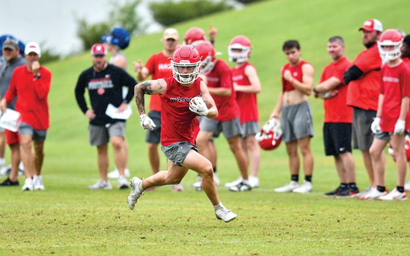 Wade Cheek/The Clayton Tribune. Rabun County senior running back Noah English finds space against Greene County at Athens Academy on Wednesday, June 4.