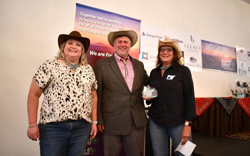 Megan Horn/The Clayton Tribune. Rabun Paws 4 Life was awarded Best Nonprofit Organization at the Forward Rabun/Rabun County Chamber of Commerce “2025 Awards Hoedown” held at The Dillard House on May 31. Pictured are Forward Rabun Board Member Nicole Queen, left; Rabun Paws 4 Life Board of Directors COO Dr. Stephen Arbitter; Rabun Paws 4 Life Fundraising and Corporate Connection Angela Luke.