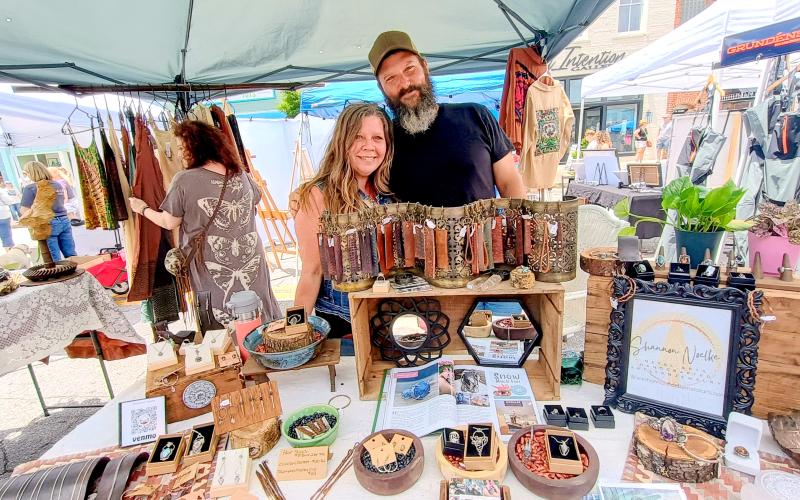 Megan Horn/The Clayton Tribune. Shannon Noelke (left) and Robert Noelke showcase their metal arts, blacksmith creations, custom accessories and much more during Ramshackle on Saturday, June 7.