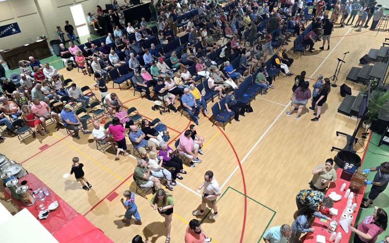 Enoch Autry/The Clayton Tribune. More than 200 people attended the watch party on the Clayton Baptist Church property to celebrate Bryner, the Blue Hound Barbecue and Grill owner.