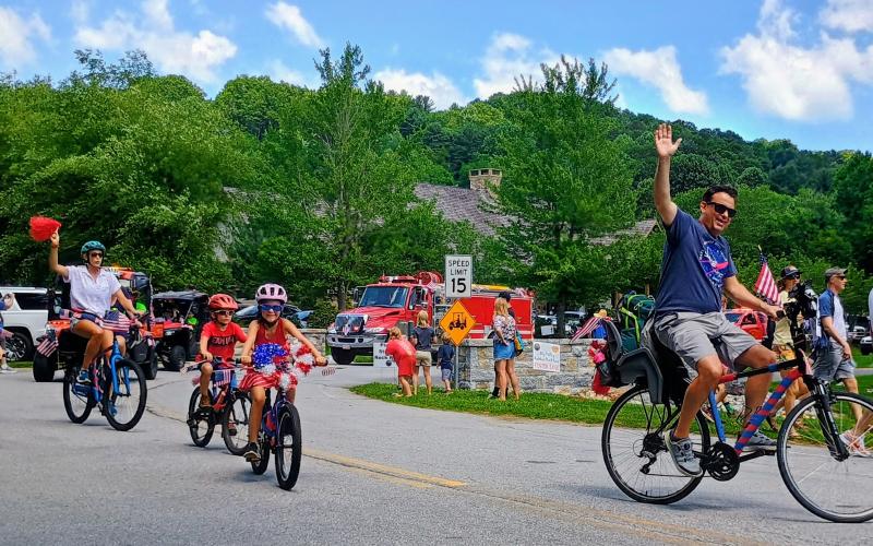 Megan Horn/The Clayton Tribune. The “Patriotic Peddlers” cycle their way through Sky Valley during the Grand Parade honoring Independence Day on Saturday, July 5.
