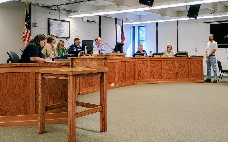 Megan Horn/The Clayton Tribune. Clayton City Attorney Mitch Baker talks about the alcohol ordinance and how it can be amended with more specific language during the July 8 work session and regular meeting of the Clayton city council.  Council members passed the first reading of the amended alcohol ordinance at a July 18 special called meeting.