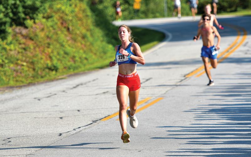 Wade Cheek/The Clayton Tribune. Clarkesville native Audrey Hotard represents Rabun well, finishing the Lake Burton Fun Run as the overall female winner for the second-straight year.