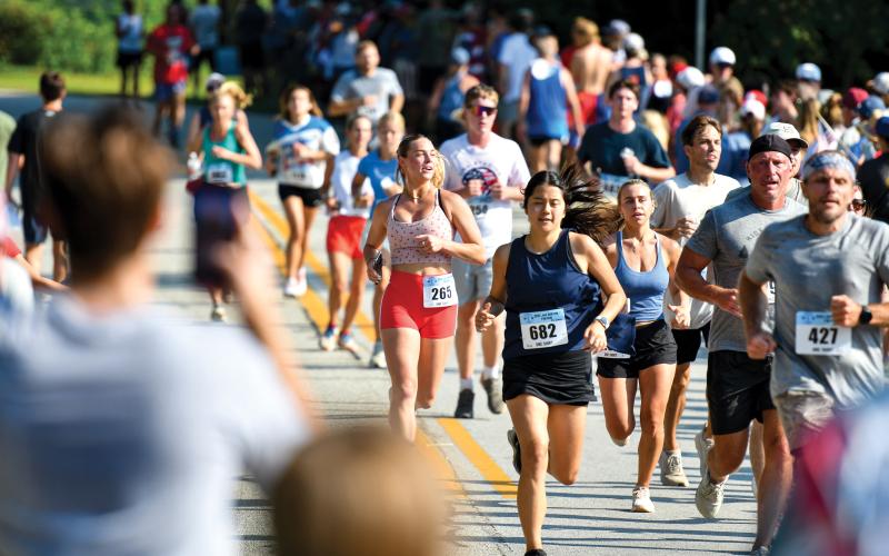 Wade Cheek/The Clayton Tribune. A total of 1,400 runners completed the two-mile lake Burton Fun Run on Saturday, July 5. The cap was limited to 1,400 entries, which was filled two weeks before the race.