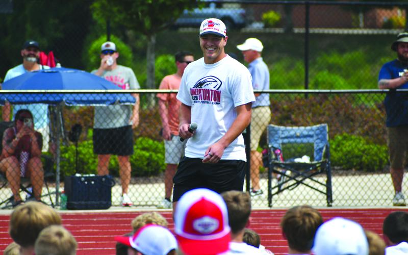 Enoch Autry/The Clayton Tribune. Former Rabun County standout Gunner Stockton laughs with the youth  at his July 20 camp.