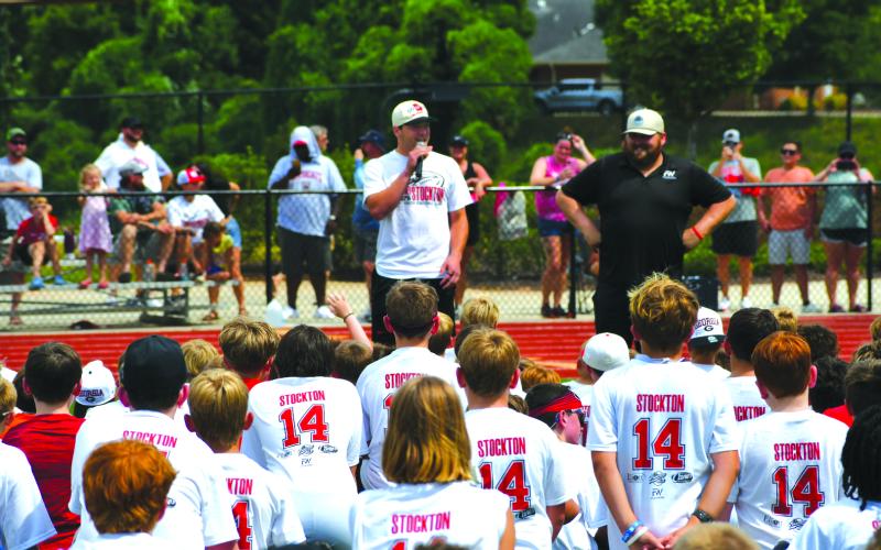Enoch Autry/The Clayton Tribune. Georgia Bulldogs’ quarterback Gunner Stockton talks with youth at his Gunner Stockton Football Camp at Lakeview Academy in Gainesville, Ga., on July 20. The campers each received a Stockton T-shirt with his jersey number 14 on the back.