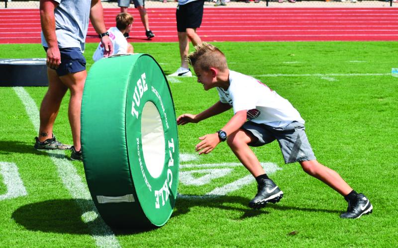 Enoch Autry/The Clayton Tribune. The campers learned the proper technique of tackling at the camp.