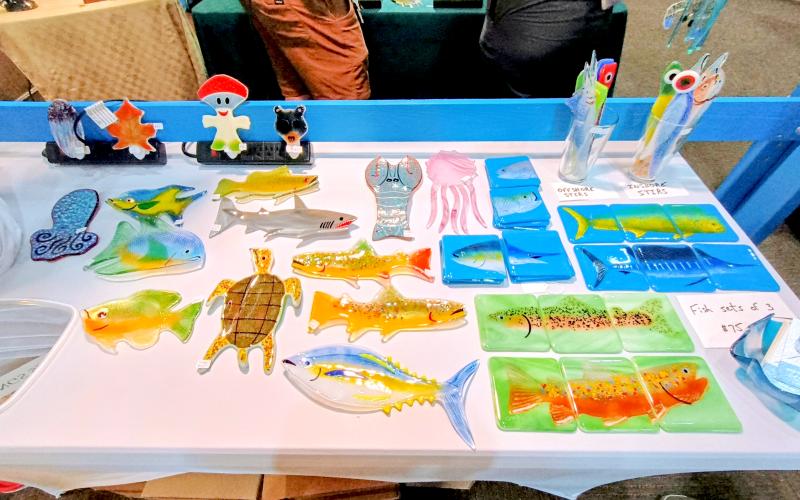 Megan Horn/The Clayton Tribune. David Oppenheimer, owner of “Wild About Glass,” has been working with glass for 35 years. He exhibited his beautifully colored and detailed glass creations that include coasters, plug-ins and hanging artwork, at the July 12 and 13 Painted Fern Art Festival.