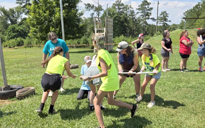 Submitted.  Rabun County girls compete in the Egg-mazing Race at the Summer Leadership Camp (SLC),  a team building challenge where students were tasked with completing certain tasks while protecting their egg. Madalen Dixon, Natalie Ramey, Emberlynn Mathis and Mary Vestal work with other students to roll the egg 20 feet.