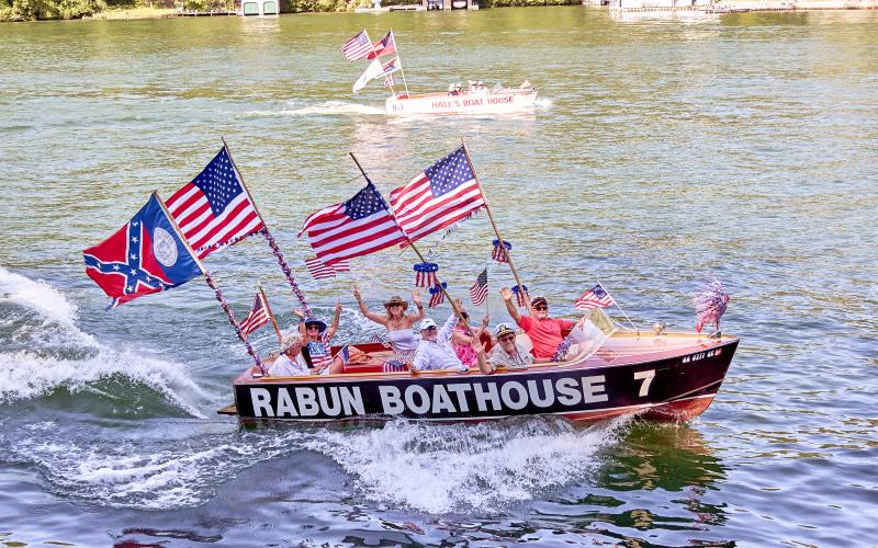 Photo courtesy K.A. Hamdy-Swink. This 1959 Chris Craft Sportsman 20-foot sure can “Hall Ass” with owners Ben and Hollis McCracken during the July 6 Lake Rabun annual Wooden Boat Parade.