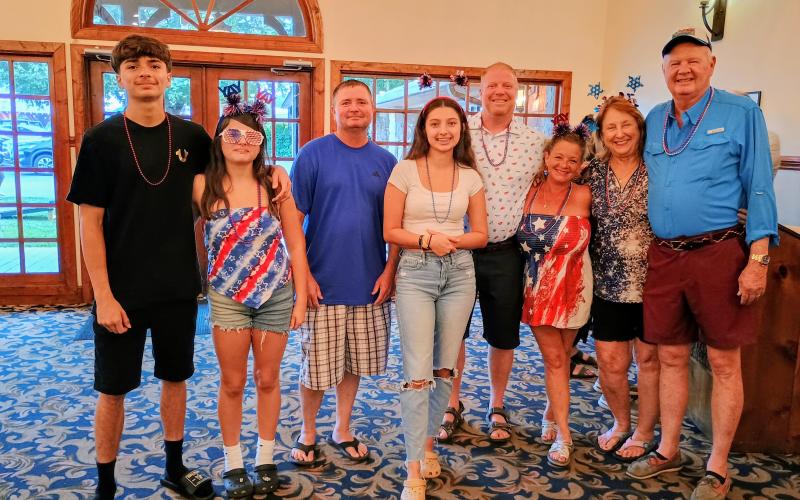 Megan Horn/The Clayton Tribune. Many families have traveled to The Dillard House for the annual Independence Day celebration for decades. Pictured are Emilio Hagan; Emma Hagan; Tim Hagan, Jr.; Estela Hagan; Jon Mull; Prima Mull; Laurie Hagan; and Tim Hagan, Sr. from St. Petersburg, Fla. The family has been coming to The Dillard House for many years.