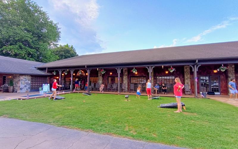 Megan Horn/The Clayton Tribune. There were many fun activities for Dillard House guests to enjoy, such as the game of cornhole, during the Friday, July 4, Independence Day celebration.