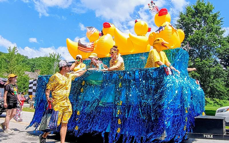 Megan Horn/The Clayton Tribune. This Sky Valley Grand Parade float on July 5 featured giant ducks on water with many decorated participants, marketing the annual Sky Valley Rubber Duck Race that had a lot of happy youth smiling. The float won First Place in the Grand Parade.