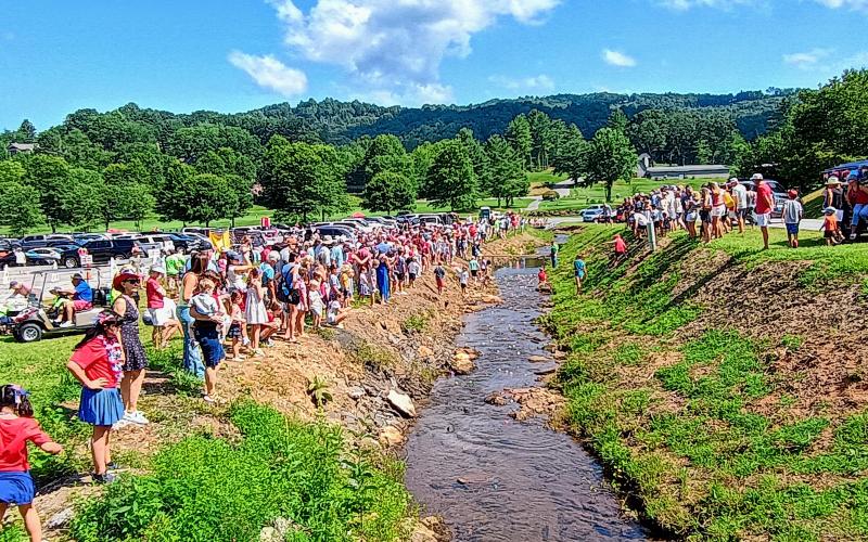 Megan Horn/The Clayton Tribune. Crowds of people flocked to Sky Valley for the annual Independence Day festivities on Saturday, July 5. Onlookers cheer for their duck, as over 515 participate in the Rubber Duck Race and race for the coveted title of being the fastest duck in Sky Valley.