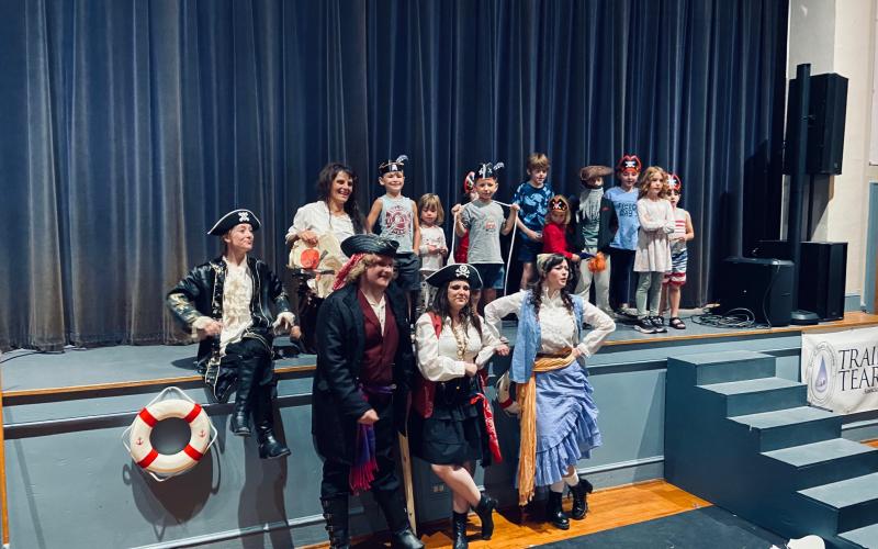 Submitted photo. Grownups (from left) Abbie Boggs, Julie Best, Peyton Wood, Sara Jones and Dannyale Williams of the North Georgia Community Players’ “Treasure Island” pose with youth who helped out as “crew” members.