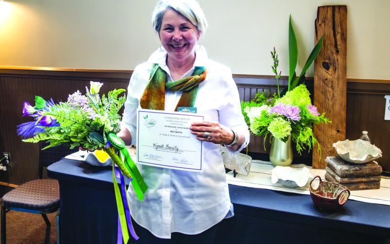 Photo courtesy Mark Barton. Exhibitor Wynell Garrity won the “Producers’ Choice Award for Best Booth” for her “artfully exhibited and stunning pottery.” This award is voted on by a panel of judges based on presentation and body of work at the annual Painted Fern Art Festival, presented by the North Georgia Arts Guild.