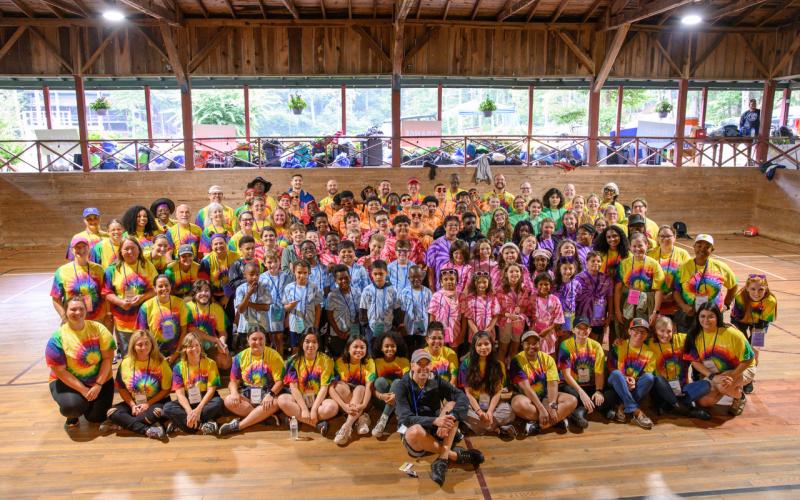 Zach Taylor/CNI News Service. PruittCares Executive Director Dave Lescalleet presented graduates Isai Bautista, Kionne James and Kaitlyn O’Donnell with “Keep Flying” bracelets to remind them of their higher purpose and drive throughout the following years of their lives after camp.