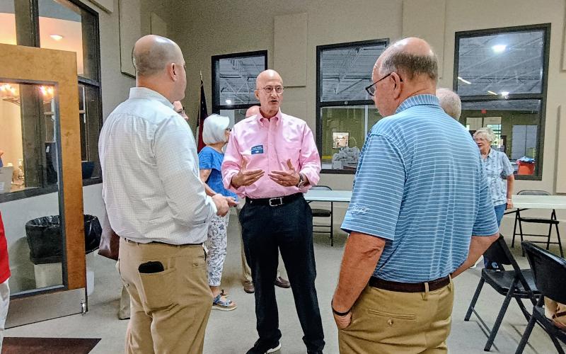 Megan Horn/The Clayton Tribune. Georgia gubernatorial Republican candidate Chris Carr, left, talks with John Rice and Rabun County resident Stewart Harvard, along with many others, during a Meet-and-Greet event held Friday, Aug. 15.