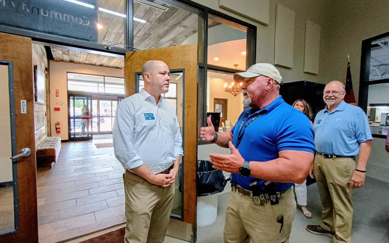 Megan Horn/The Clayton Tribune. Rabun County Sheriff Mark Gerrells, right, talks with Georgia gubernatorial Republican candidate during a campaign Meet-and-Greet event at the Food Bank of Northeast Georgia Friday, Aug. 15. Gerrells made remarks about the great working relationship his office has with the attorney general who is running for governor in the 2026 race.