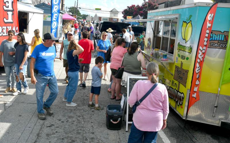 Enoch Autry/The Clayton Tribune. Clayton Downtown Block Party had 10 food trucks that fed hundreds of hungry visitors on Aug. 9.