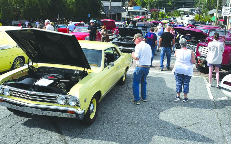 Enoch Autry/The Clayton Tribune. While food trucks were packed in on one end of Main Street in Clayton on Aug. 9, 160 classic vehicles were on hand at the Clayton Block Party for hundreds to check out.