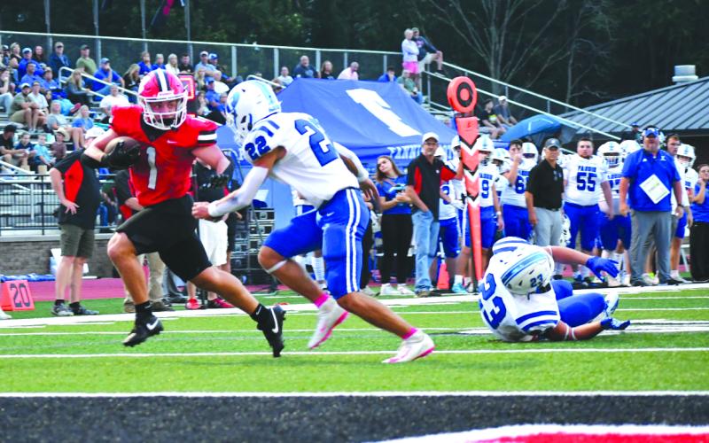Enoch Autry/The Clayton Tribune. ABOVE RIGHT: Senior running back Lake Evans evades Fannin County defenders en route to the end zone in the Wildcats’ victory. Evans went over 100 yards on the ground the contest.