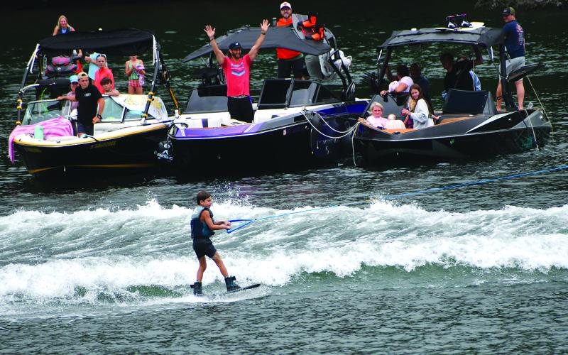 Enoch Autry/The Clayton Tribune. The first wakeboarder of the day James Bradley receives accolades from people in the GROM Division of the Mountain Air Classic on Aug. 2.