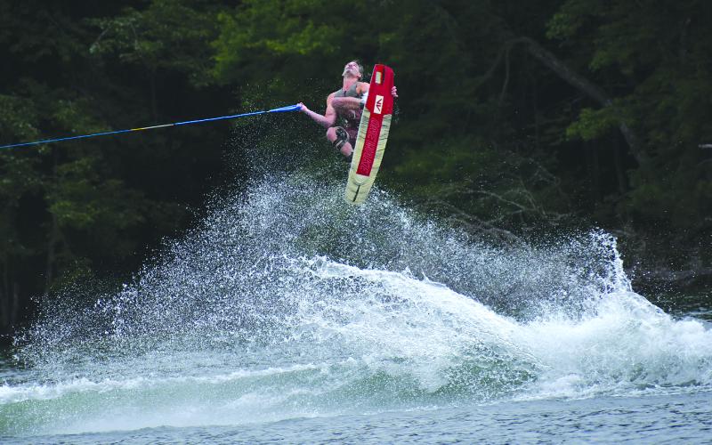 Enoch Autry/The Clayton Tribune. Benj Trodgon gazes upward on his wakeboard during the 25th annual Mountain Air Classic on Lake Burton near Billy Goat Island. Trodgon, a 31-year-old who has been wakeboarding for 20 years, won the Outlaw Division which is the competition’s best of the best.