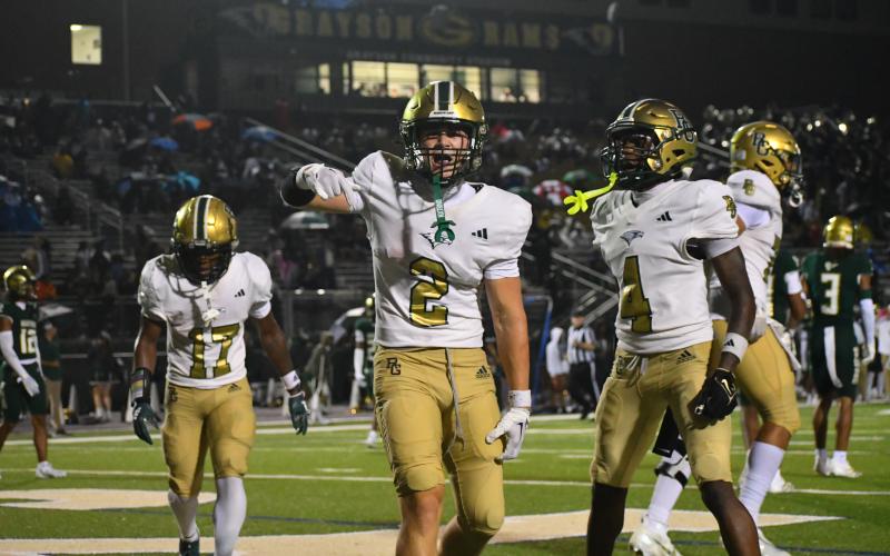 Wesley Branch/The Clayton Tribune. Rabun Gap senior and Indiana commit Walker Bryson celebrates in the end zone after a touchdown against Grayson in RGNS’s 24-19 loss to begin the season in a game with national football powerhouses.