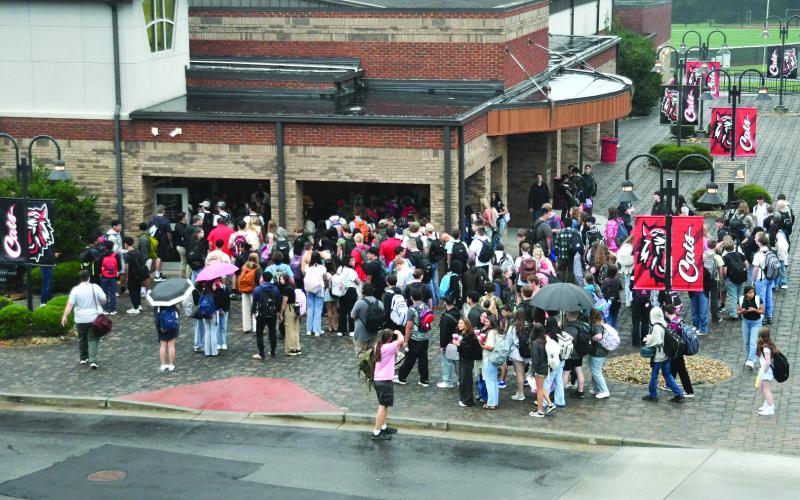 Enoch Autry/The Clayton Tribune. Rabun County High School students prepare to go inside the Fine Arts Building for a first-day-of-school pep rally in the morning. Students at Rabun County Middle School go to their new lockers to get their supplies for their first-period class.