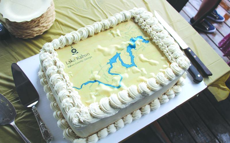 Wesley Branch/The Clayton Tribune. A memorable cake with a map of Lake Rabun was created by Cissy Jackson’s neighbor Karen Johnson. Jackson swam the lake on Aug. 11