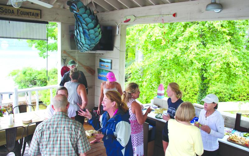 Wesley Branch/The Clayton Tribune. A celebration was held at a Lake Rabun residence after Cissy Jackson’s swim across the lake on Aug. 11.