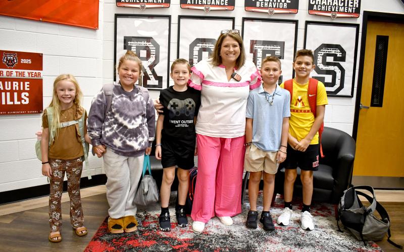 Megan Horn/The Clayton Tribune. Rabun County Elementary School (RCES) had its first day back on Monday, Aug. 4. Pictured at the start of the day are Hayden Worley, third grade; Emmaleigh Mathis, fourth grade; Jax Shook, fourth grade; RCES Principal Keri Coleman; Parker Satterfield, sixth grade; and Coleman Dixon, fourth grade.