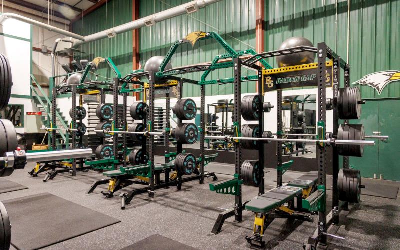 Submitted Photo. The upgraded Rabun Gap weight room now has a college-level feel to it. The previous weight room setup had just four racks, but this one that opened this month has 12 racks for the Eagle student-athletes.