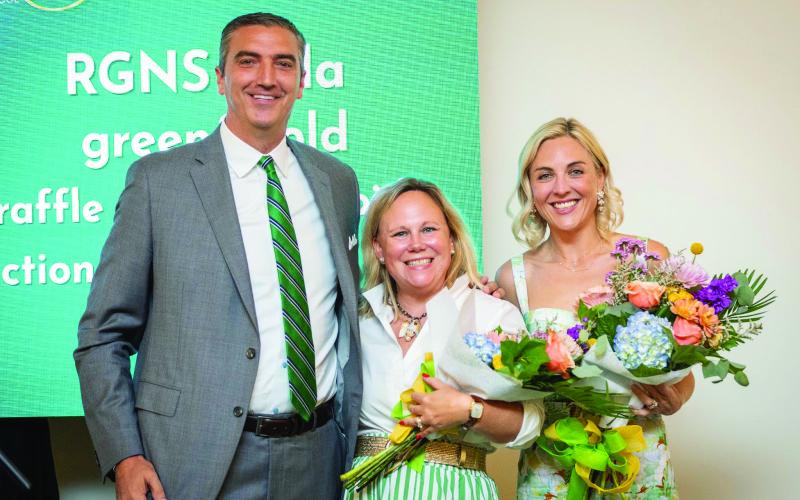 Submitted. Rabun Gap-Nacoochee School celebrated its third annual Green &amp; Gold Gala on Saturday, Aug. 23, at The Dillard House. Pictured, Head of School Jeff Miles recognizes Gala co-chairs and current parents Sarah Barge and Andrea Sorgeloos. The gala raised $260,500 for Rabun Gap students, teachers and programs.