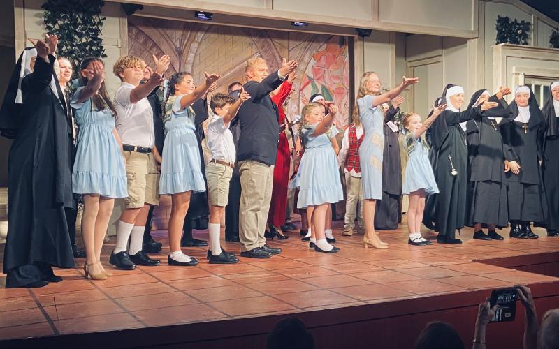 Photo courtesy Steven Webster. North Georgia Community Players actors take a stage bow after opening night of “The Sound of Music” last weekend. Pictured in the center are Anthony Schandel, who plays Captain Georg von Trapp, and Lucy Barry, who plays Maria. There are still two more weekends to see the show at the Dillard Theater, Aug. 15-17 and Aug. 22-24.