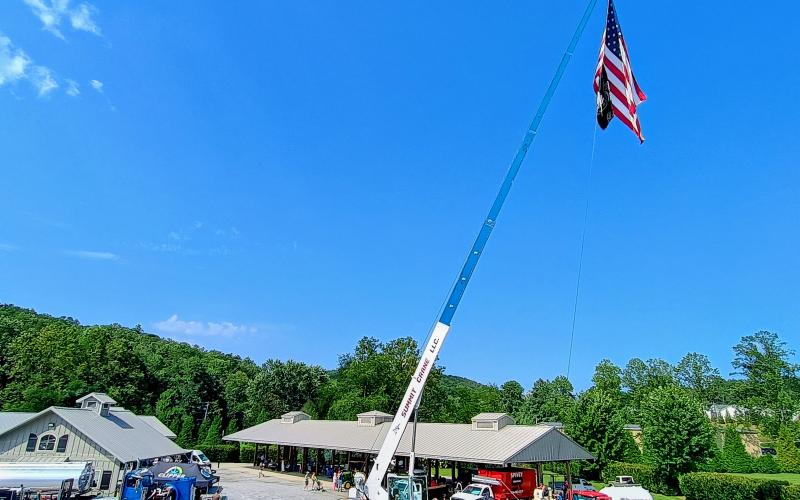 Megan Horn/The Clayton Tribune. This flag of the United States of American proudly waved during the Saturday, Aug. 16, “Touch-A-Truck” event thanks to Summit Crane, LLC. The event supported Rabun County Fuller Center for Housing.