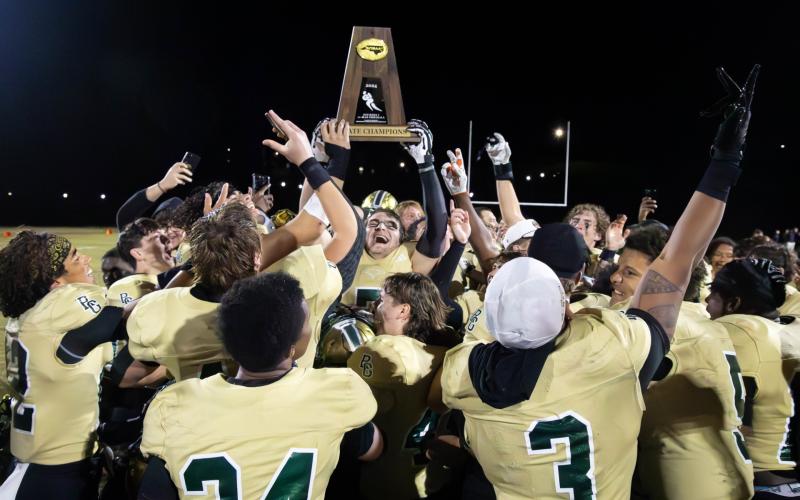 File Photo/The Clayton Tribune. Last year the Rabun Gap Eagles hoisted their first football state championship. The road to potentially repeat will be involve navigating through one of the toughest high school schedules in America. RGNS begins its season at national power Grayson on Aug. 22.