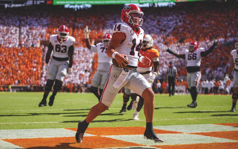 Tony Walsh/UGAAA. Georgia quarterback Gunner Stockton runs into the end zone during Georgia’s 44-41 overtime win over Tennessee at Neyland Stadium in Knoxville, Tenn., on Sept. 13. Stockton also threw two TD passes.