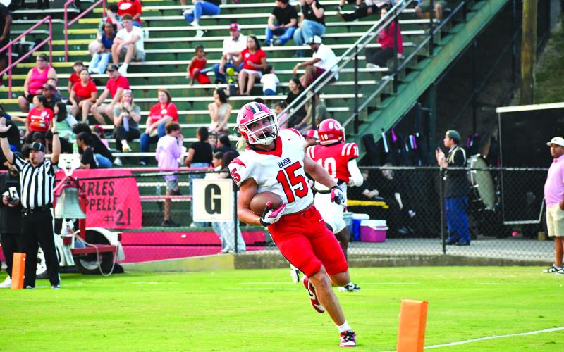 Wesley Branch/The Clayton Tribune. Rabun County senior Reid Giles celebrates in the end zone following a touchdown versus Dalton in the Wildcats’ 49-42 win on Sept. 5. Giles scored four touchdowns in the road victory as he rolled up 424 all-purpose yards en route to being named the state’s player of the week.