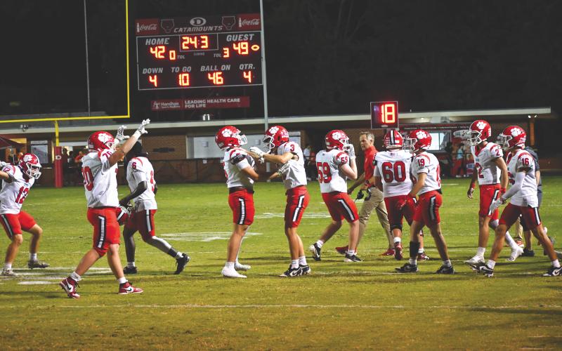 Wesley Branch/The Clayton Tribune. e Rabun County Wildcats claimed victory in a barn burner of a football game on the road at Dalton on Sept. 5. RCHS moved to 3-0 on the season with the 49-42 triumph. Here, Wildcat players celebrate with just 24.3 seconds remaining after senior Lake Evans intercepted a Dalton pass to secure the win. The Wildcats will be at Bremen on Friday, Sept. 12