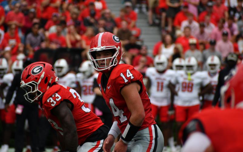 Wesley Branch/The Clayton Tribune. Former RCHS and current UGA quarterback Gunner Stockton prepares to take a snap versus Austin Peay on Sept. 6.